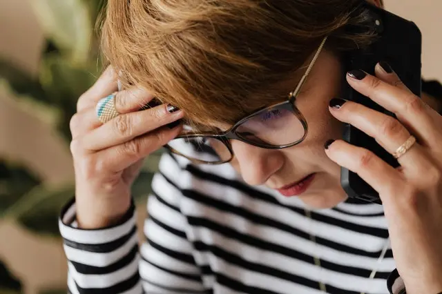 worried woman on the phone