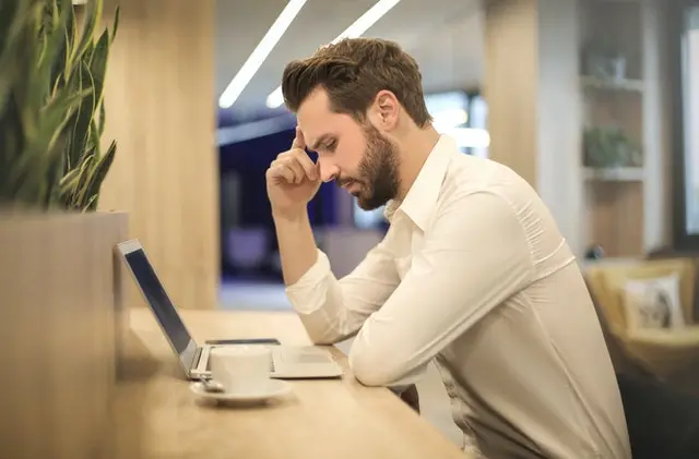 worried man at a desk